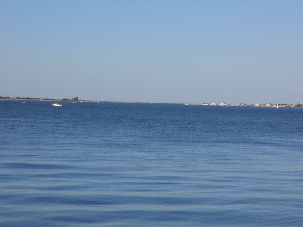 The mouth of the Merrimack River seen across Newburyport Harbor, with Salisbury Beach on the far left and Plum Island on the right